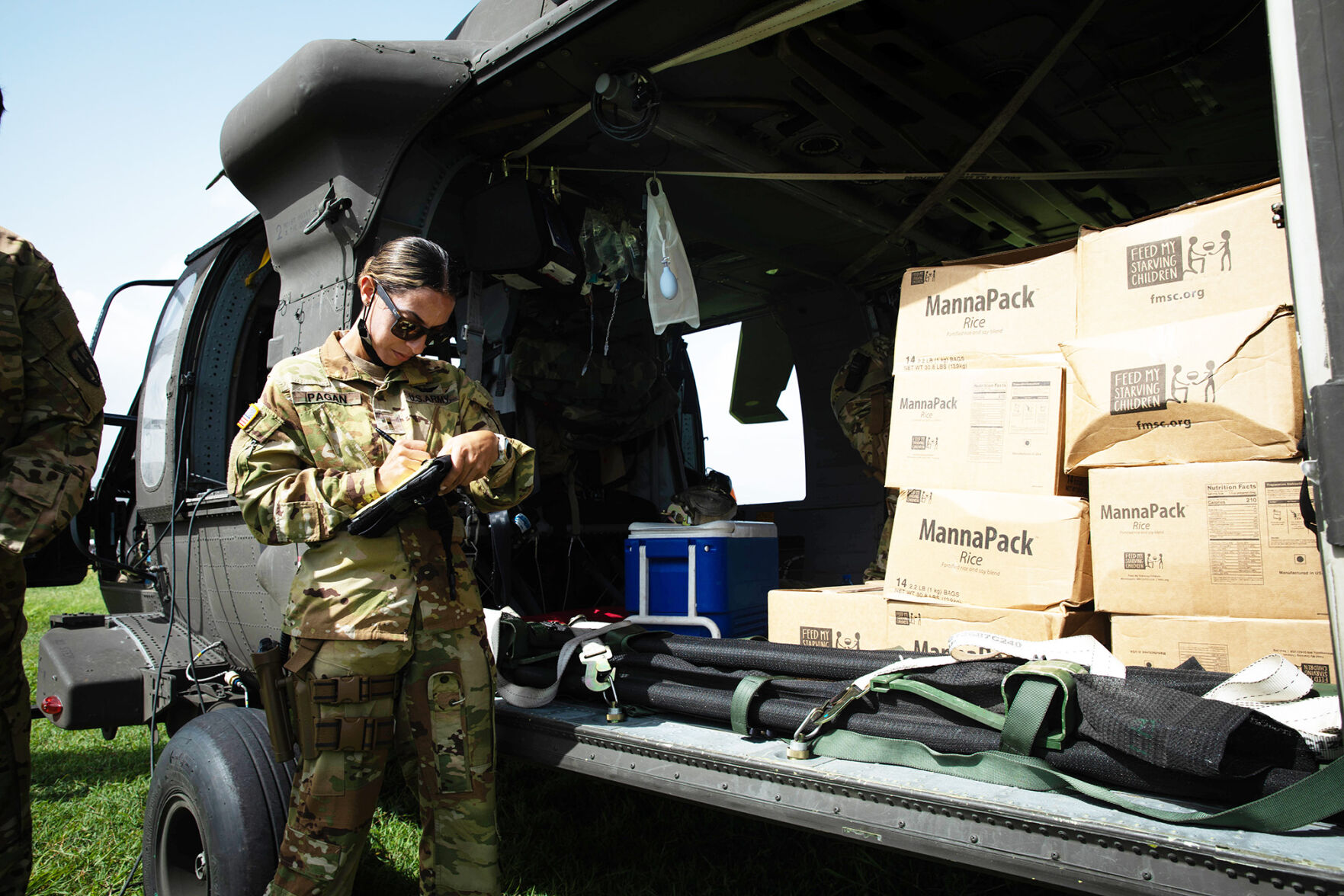 Warrant Officer Adaliz Pagan takes inventory before transporting food provisions to the community of Jeremie, Haiti. Guardsmen from the Puerto Rico Army National Guard Aviation have been assisting in the aid-relief efforts Sgt. Agustin Montanez